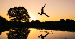 Man jump during sunset