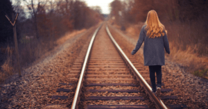 Girl on train track